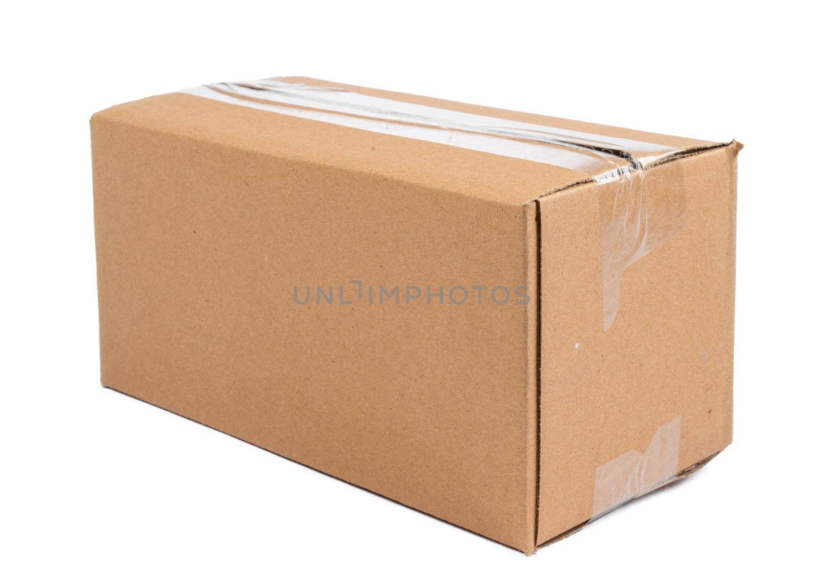 Single carton moving box isolated on white background. Close up.