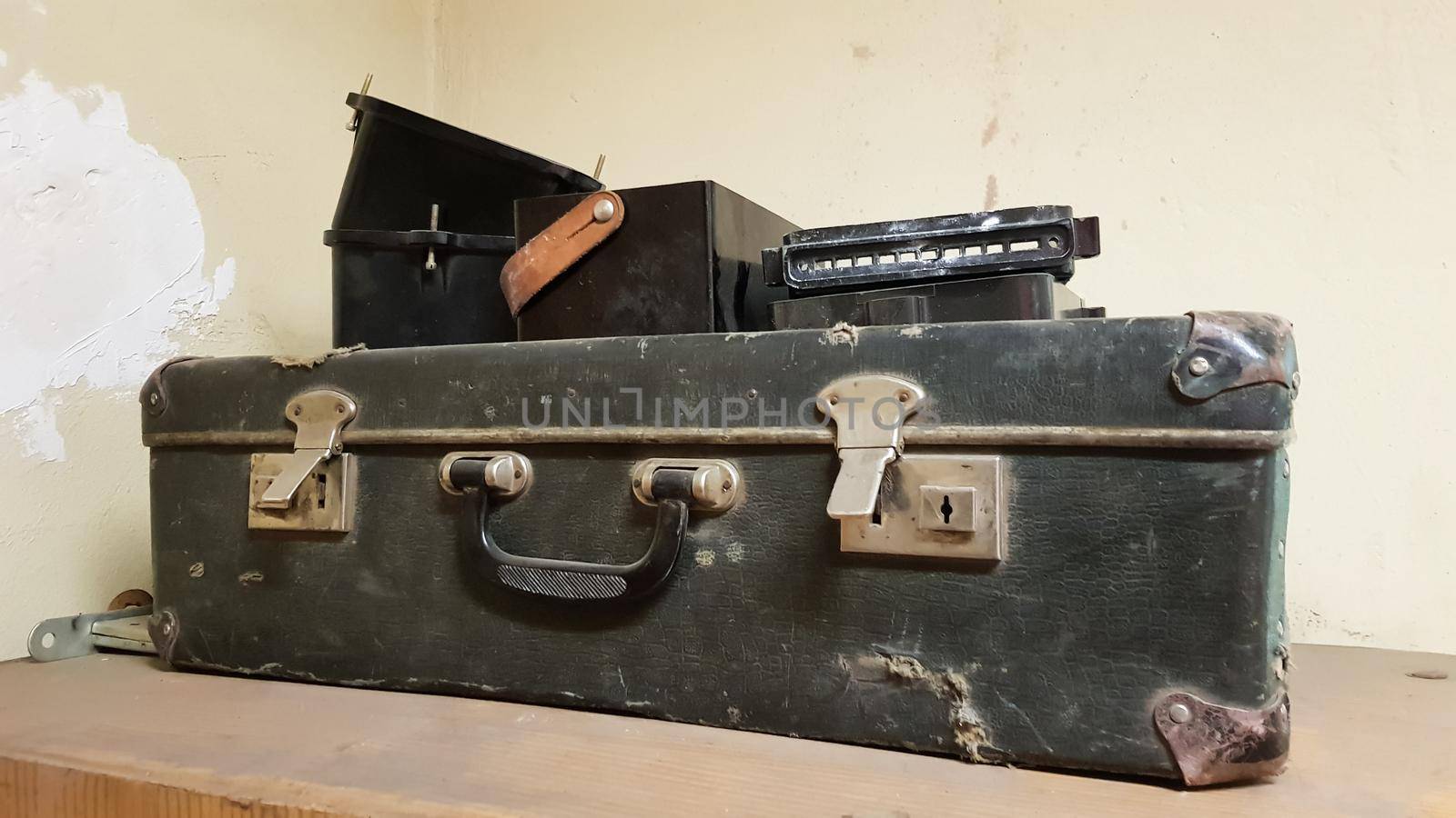A vintage one classic travel leather suitcase around the 1940s. Luggage concept