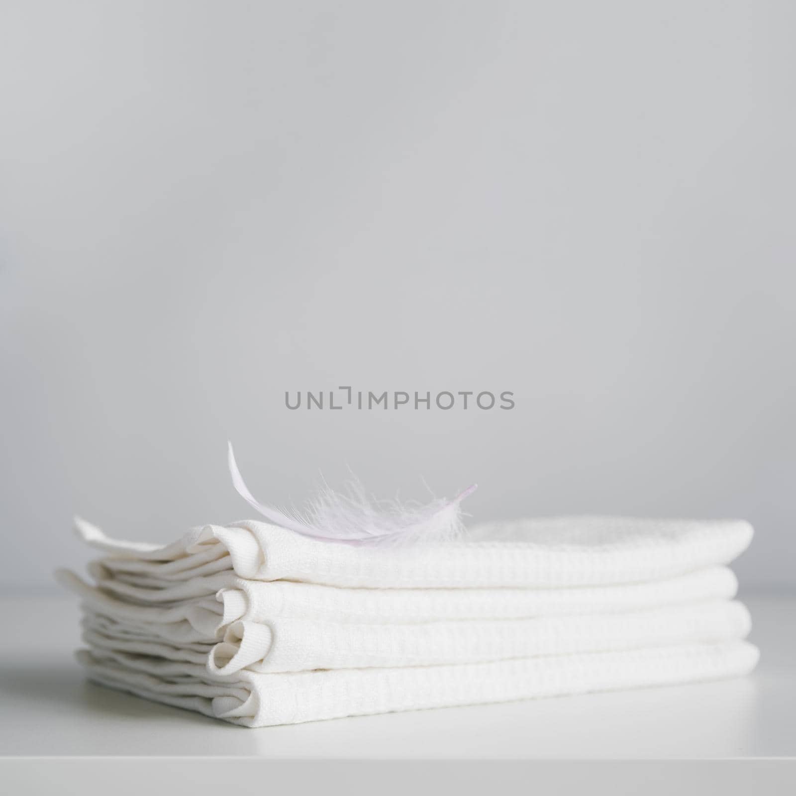 front view stacked white towels by Zahard