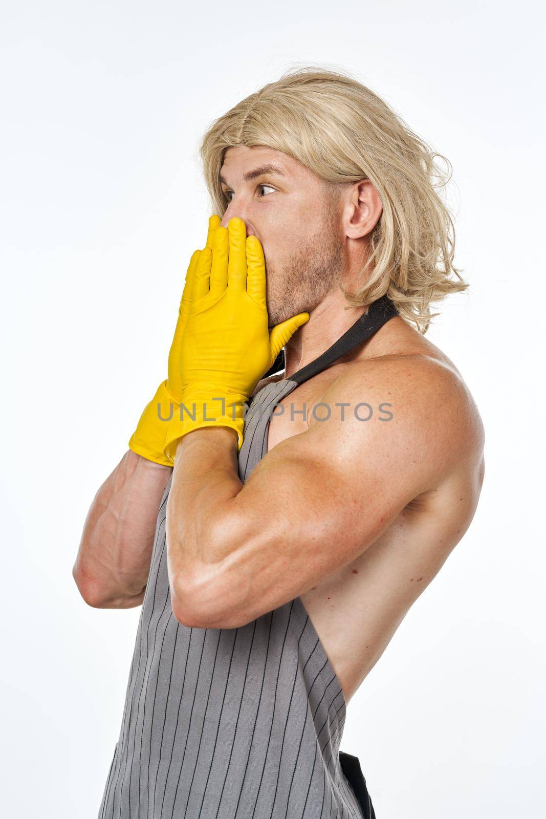 man in yellow rubber gloves in a woman's wig cleaning posing by Vichizh