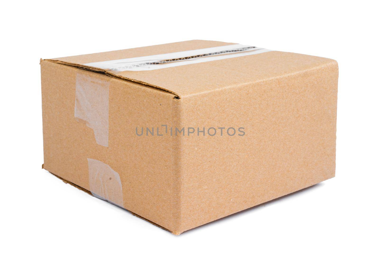 Single carton moving box isolated on white background. Close up.