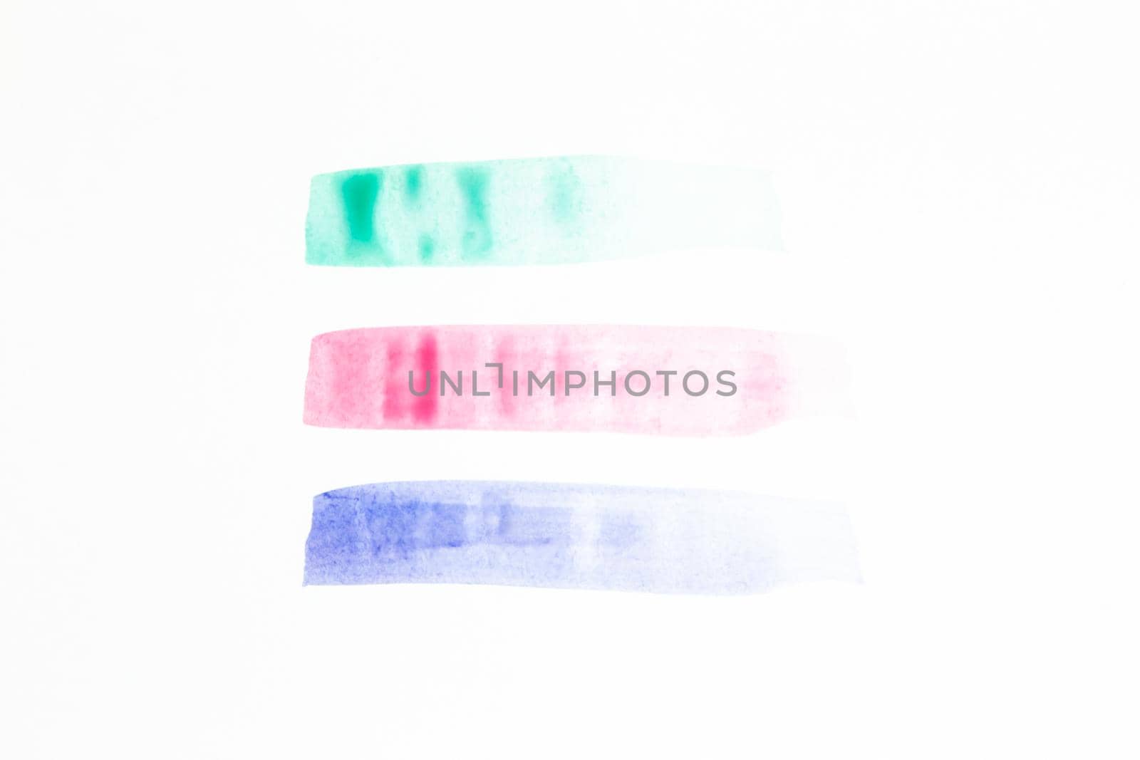 Collection of green, pink and purple smears of acrylic paint isolated on white background.