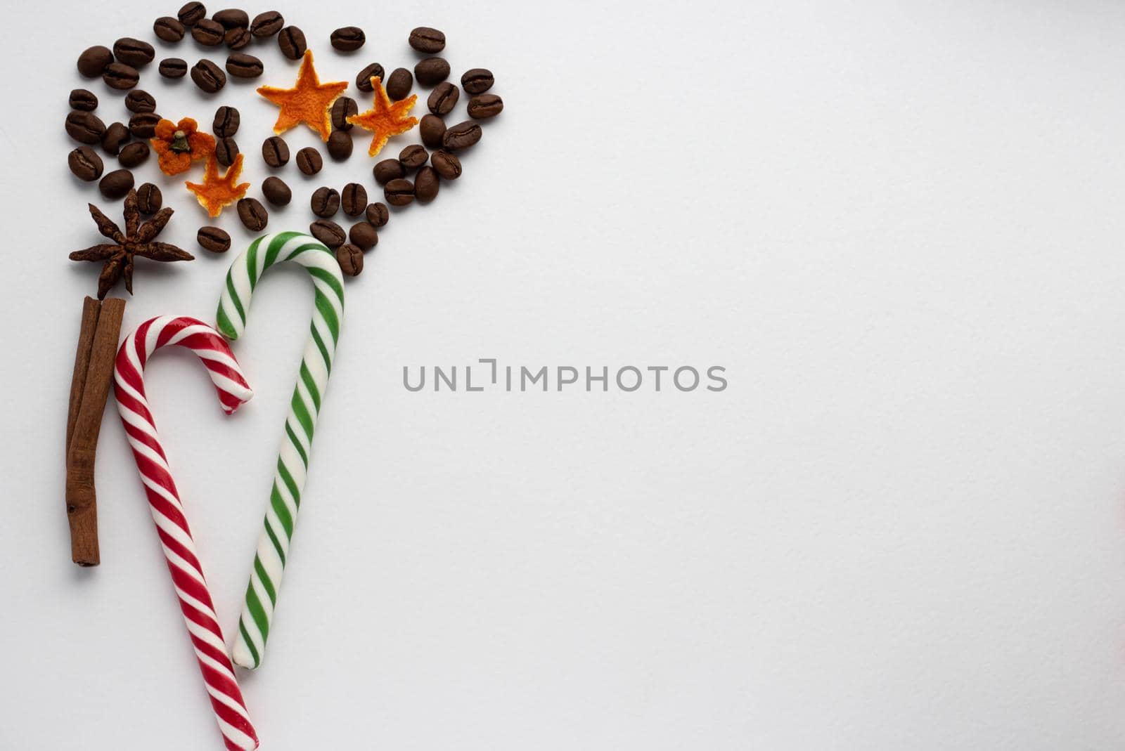 Mint hard candy cane striped in Christmas colours isolated on a white background. Closeup. by lapushka62