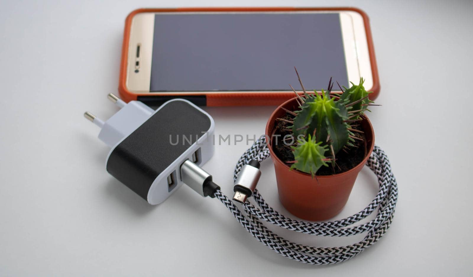 Electric socket with connected phone charger.technology mobile by lapushka62