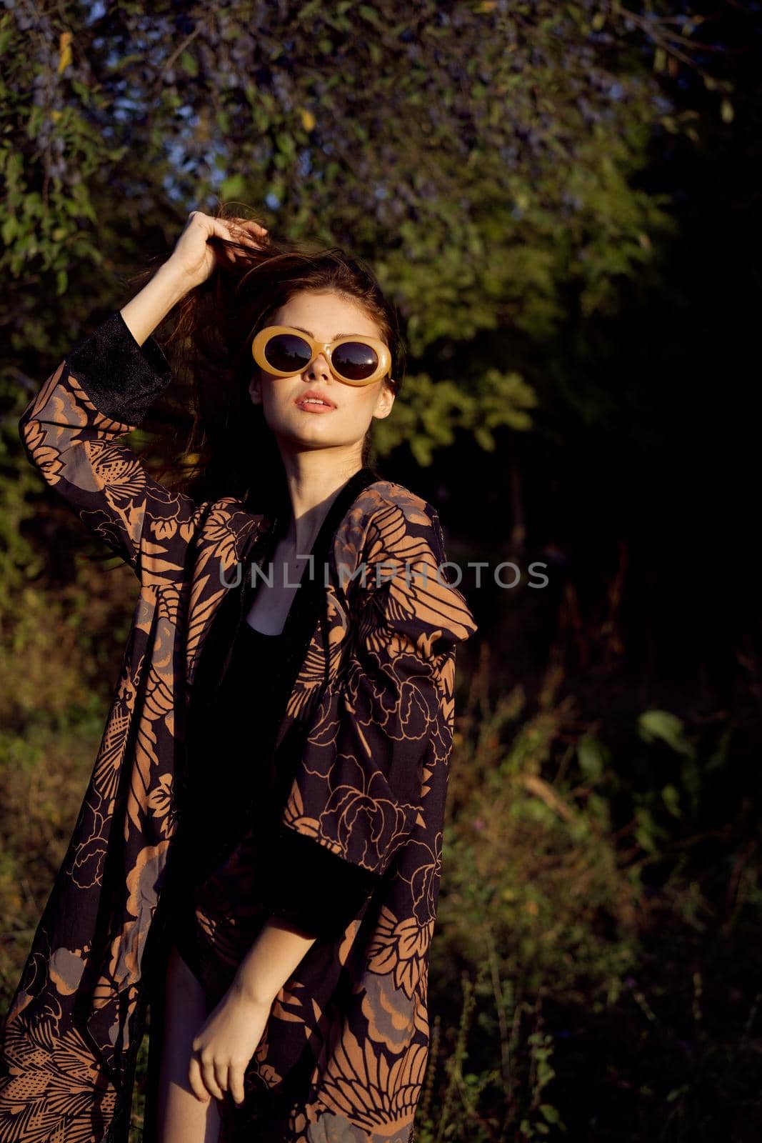 woman wearing sunglasses outdoors posing fashion glamor by Vichizh