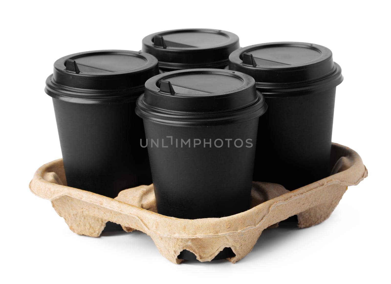 Four takeaway coffee cups in a tray isolated on white background