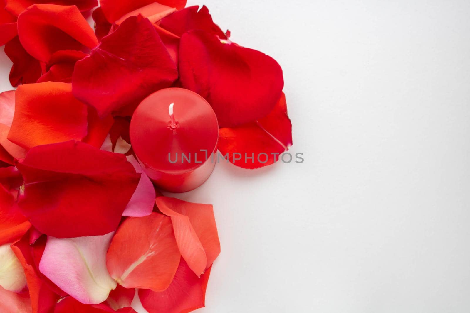 The candles stand on the table white background by lapushka62