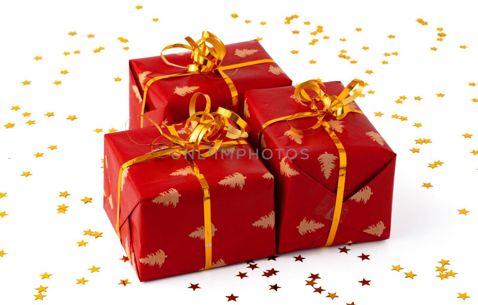 Christmas present gift box with confetti isolated on white background, close up