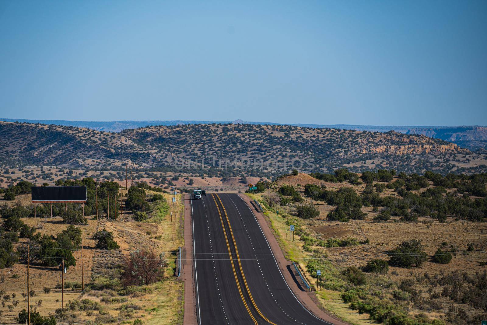 Natural american landscape with asphalt road to horizon. by Tverdokhlib