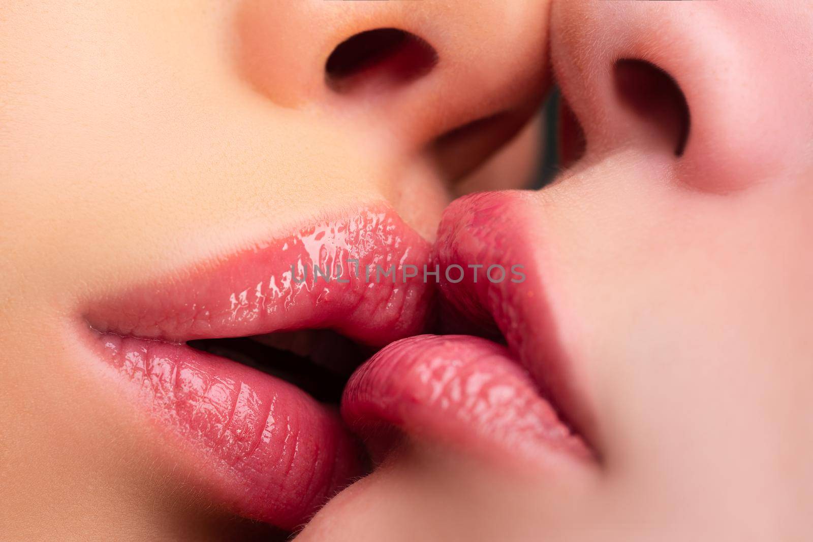 Lgbt couple. Lesbian kissing. Kiss red lips. Sexy mouth. by Tverdokhlib