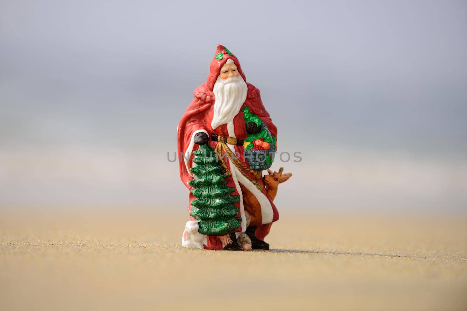 Santa Claus, tropical vacations concept. Christmas or New Year decoration on sea beach background with copy space. by Tverdokhlib