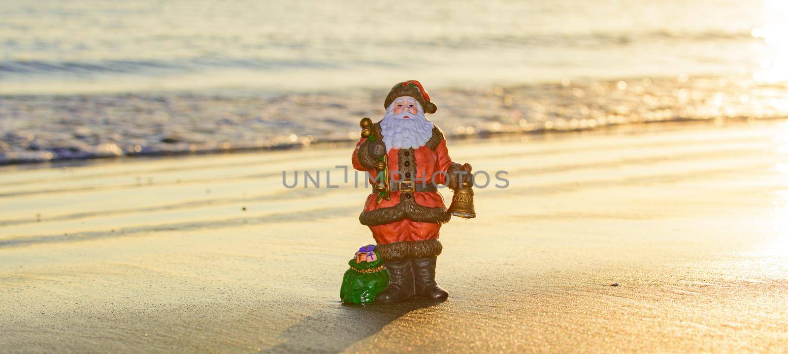 New Year travel. Toy summer Santa. Christmas banner, poster or greeting cards