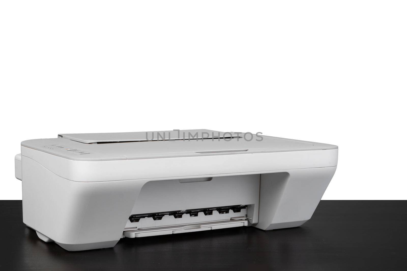 Laser home printer on table against white backgorund by Fabrikasimf