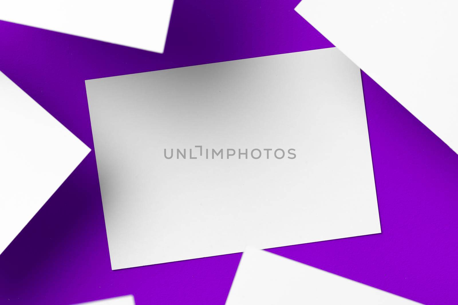 Blank white businesscards on purple background, copy space by Fabrikasimf