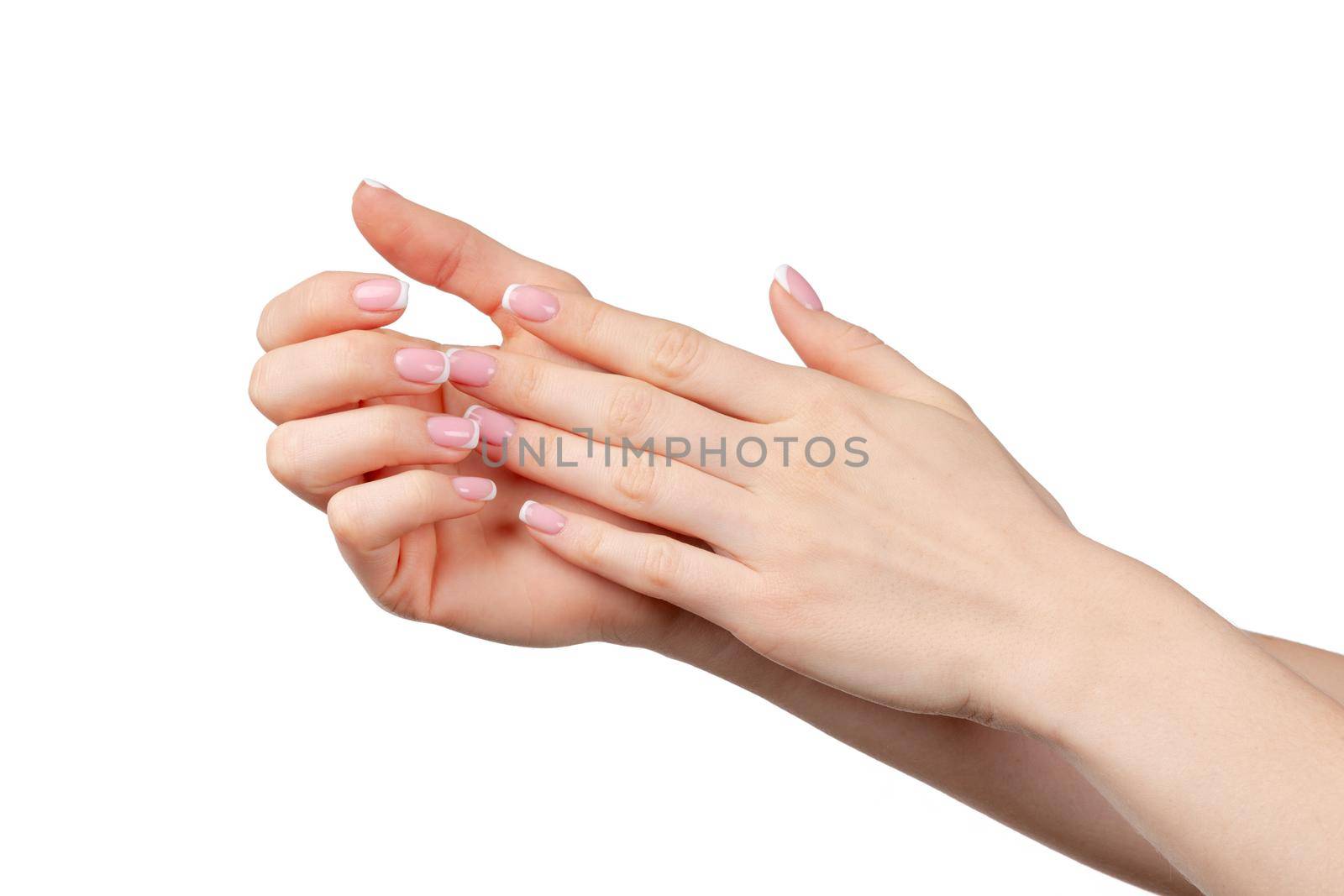 Well-groomed female hands with manicure on white background close up