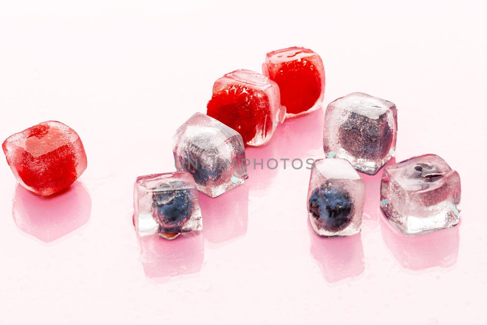 Ice cubes with berry for summer cocktails. High quality photo