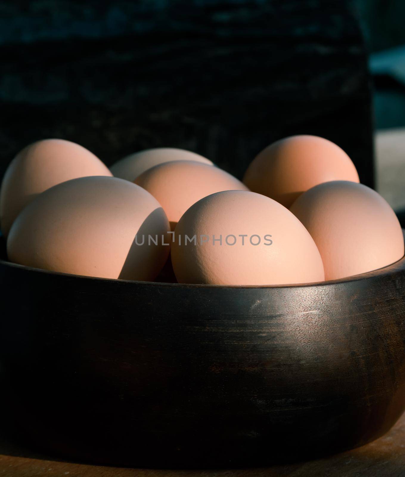 Close up Plate of eggs. On old wooden kitchen table, side view.