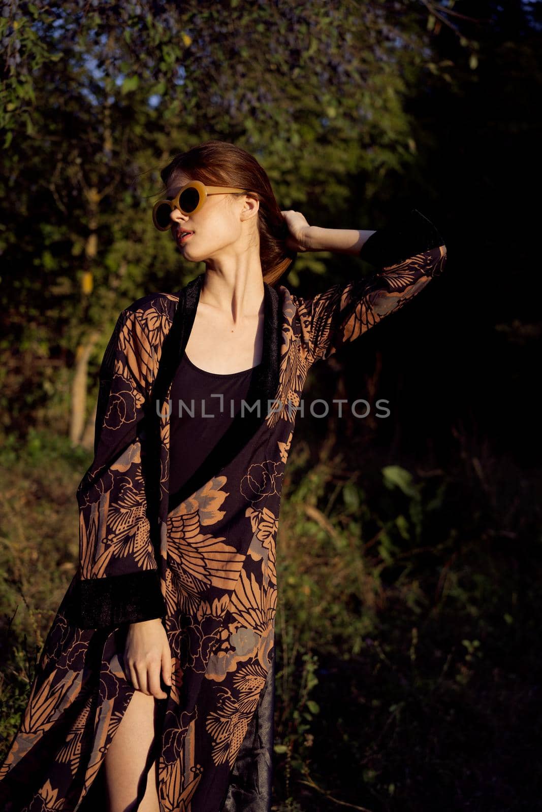 pretty woman in fashionable clothes sunglasses nature posing by Vichizh