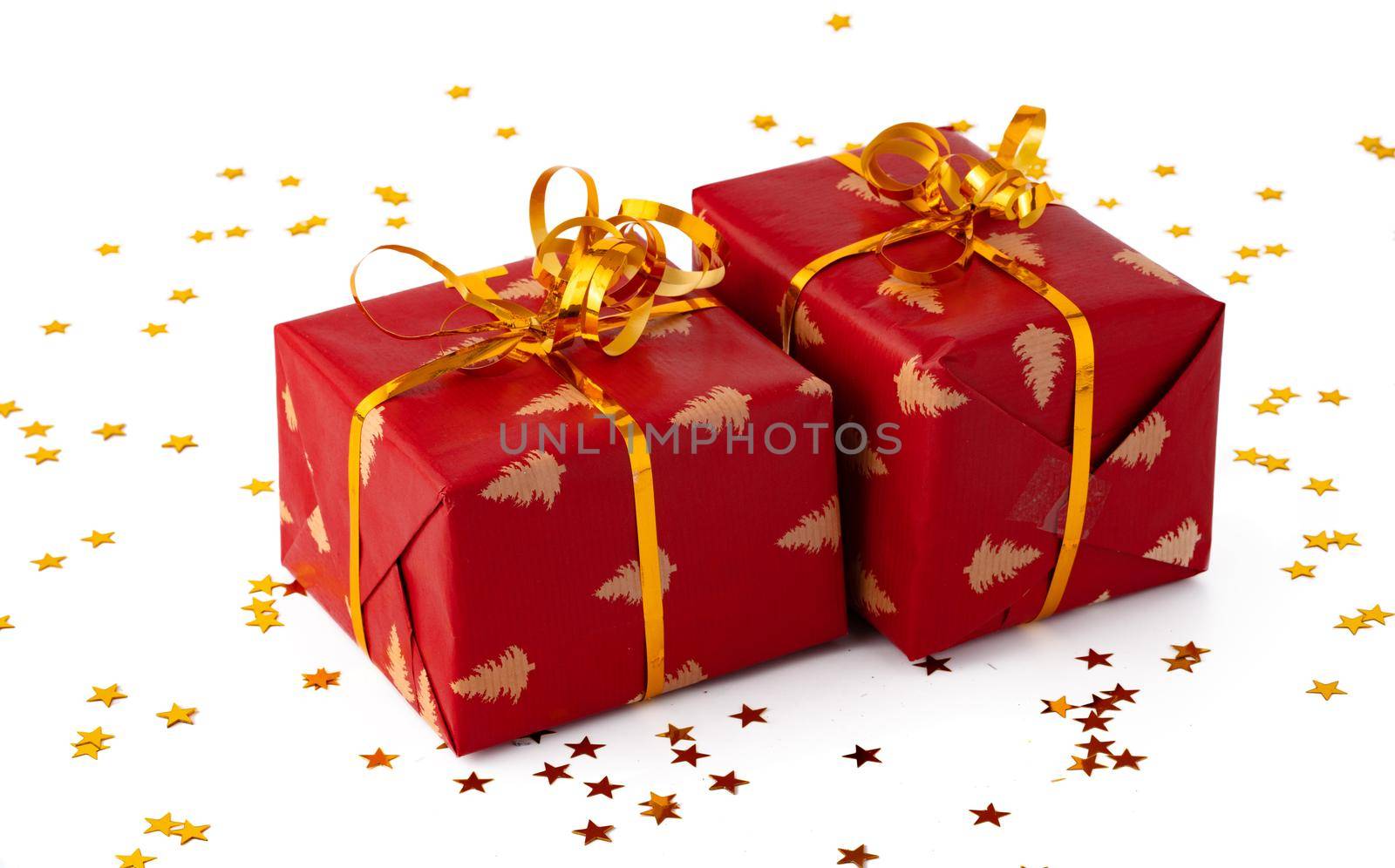 Christmas present gift box with confetti isolated on white background by Fabrikasimf