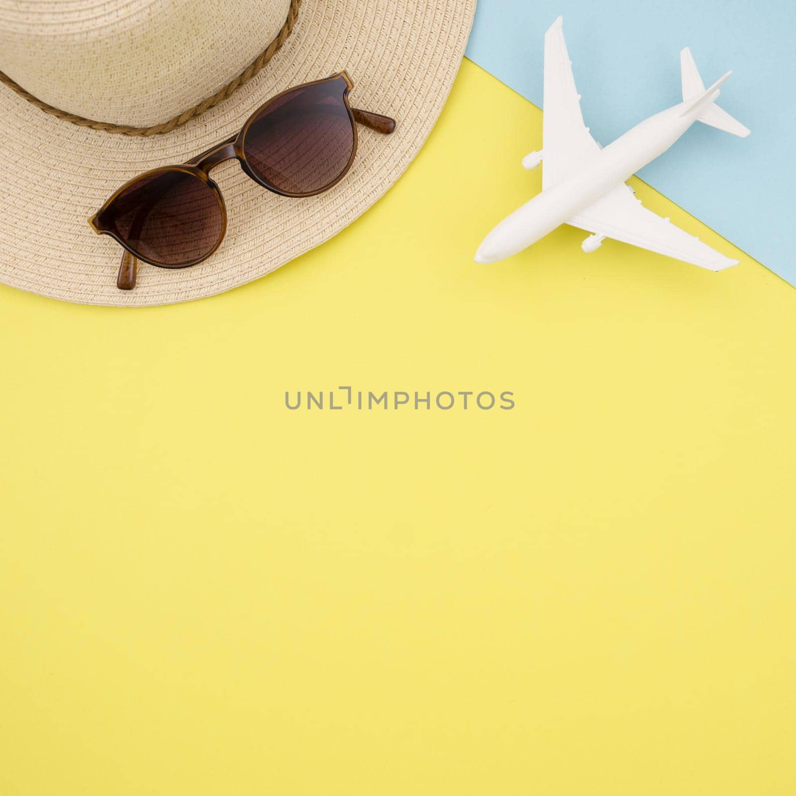 flat lay yellow background with hat glasses by Zahard