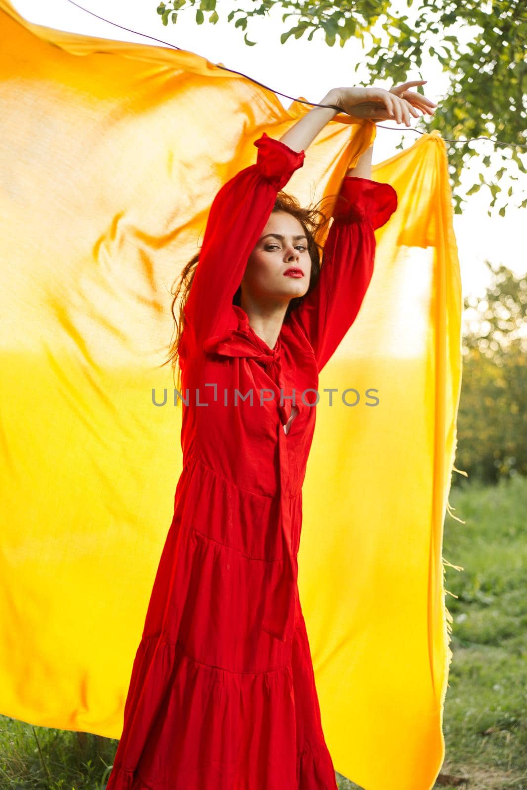 pretty woman nature yellow cloth fresh air glamor. High quality photo