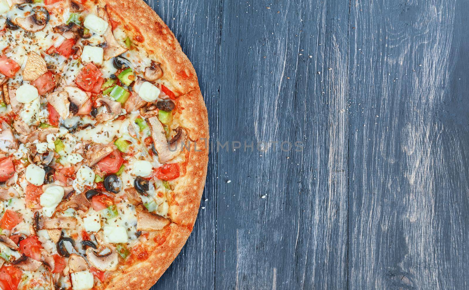 pizza close-up on a wooden surface