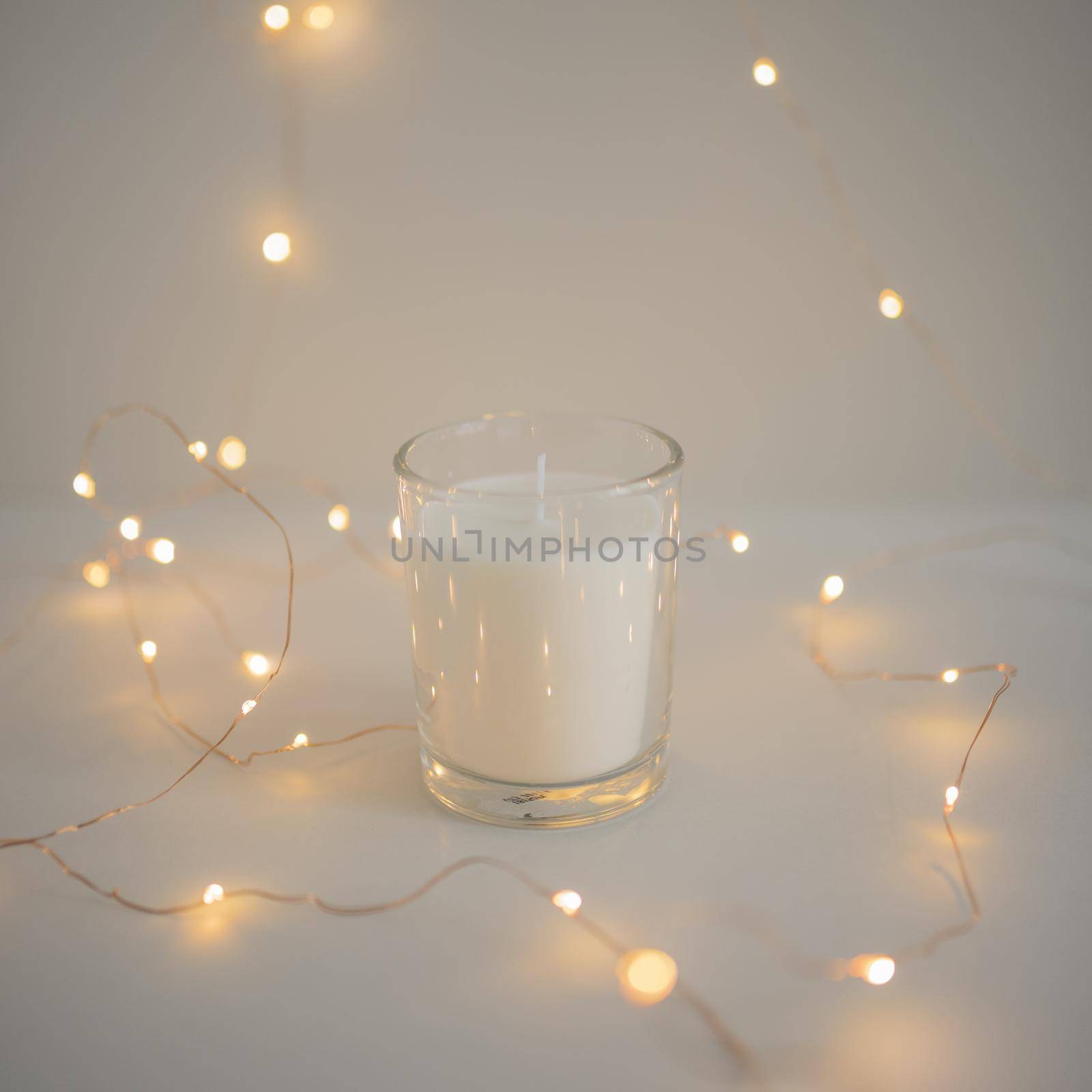 decoration fairy lights around glass candleholder by Zahard