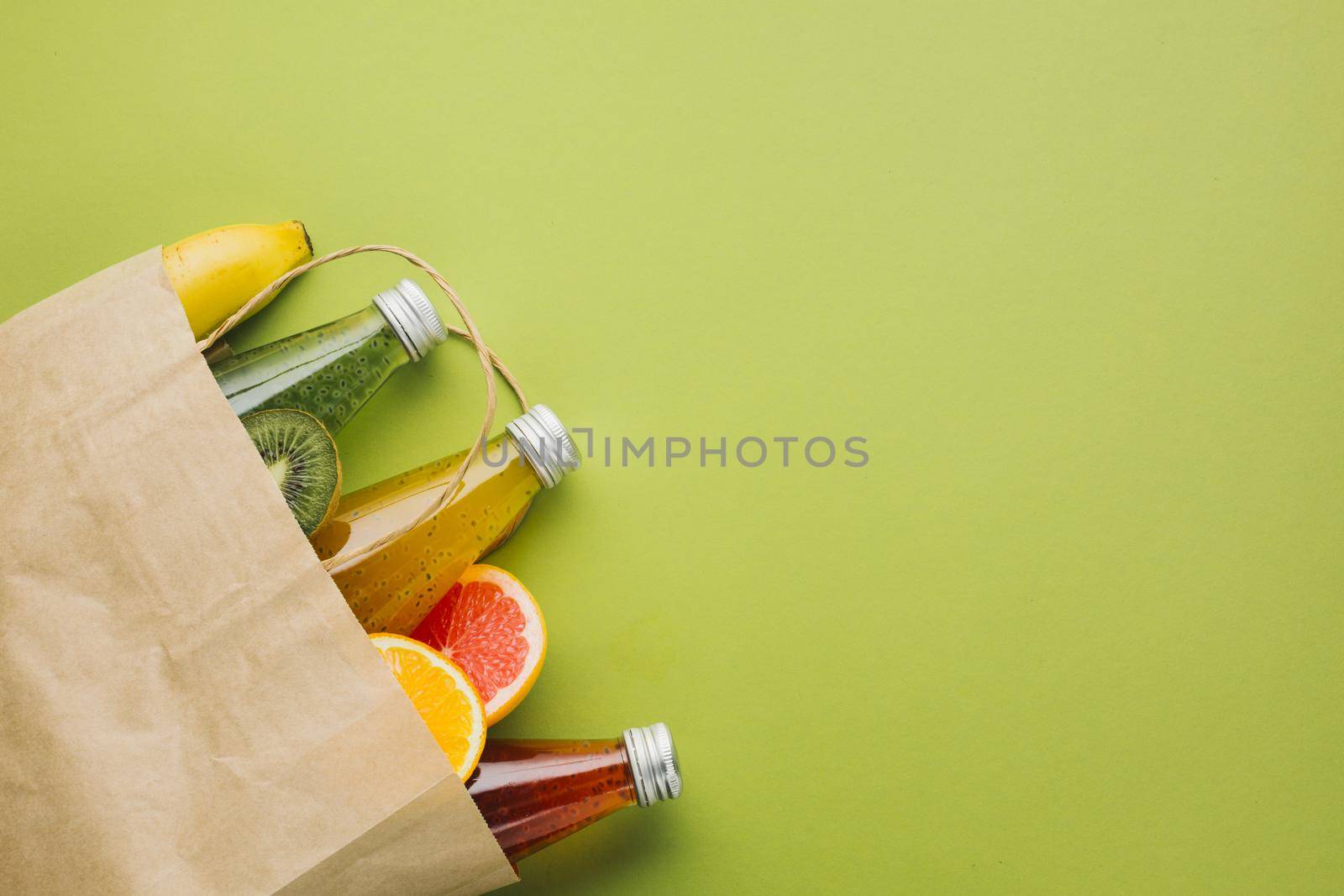 flatlay paper bag with fruit juices by Zahard