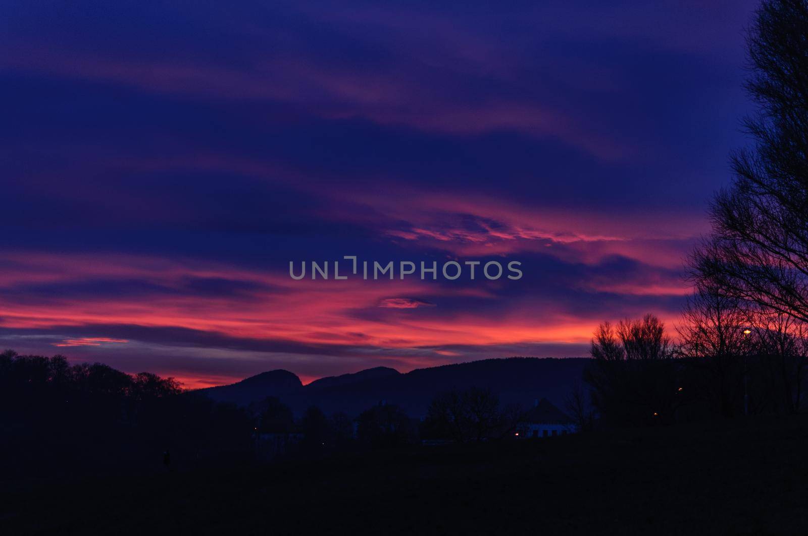 Sunset over Mountains. Night dark blue and pink sky by shanserika