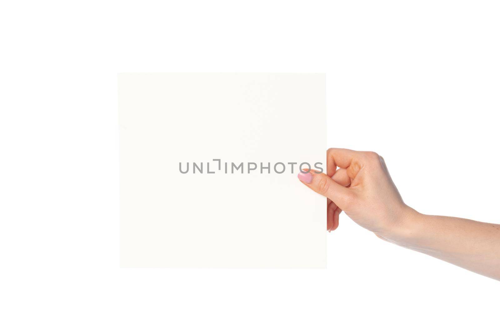 Woman's hand showing white paper banner isolated on white by Fabrikasimf