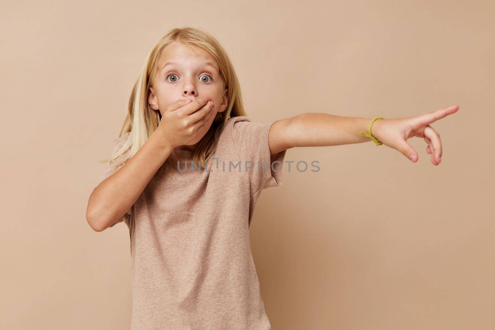 happy child gestures with his hands isolated background. High quality photo