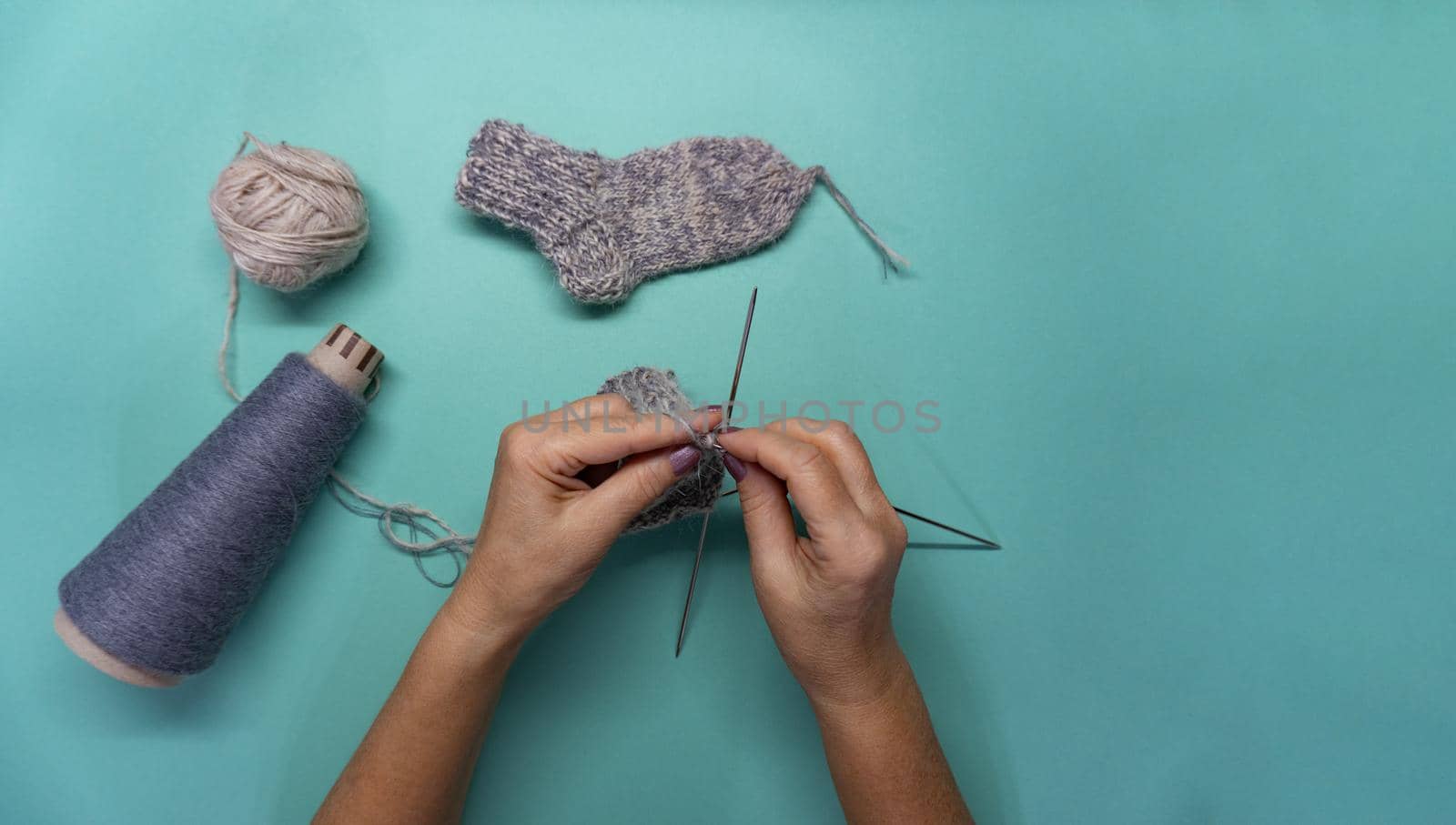 Flat lay of knitting socks by uveita