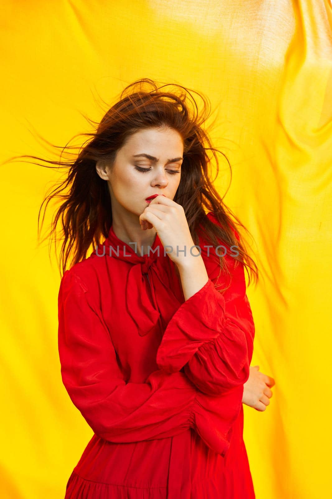 pretty woman in red dress nature yellow cloth on background by Vichizh