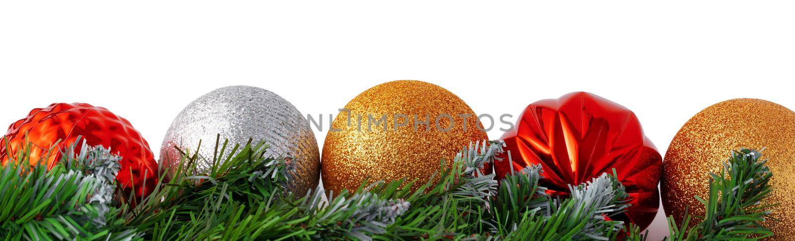 Christmas tree branch with Christmas baubles isolated on white background, copy space