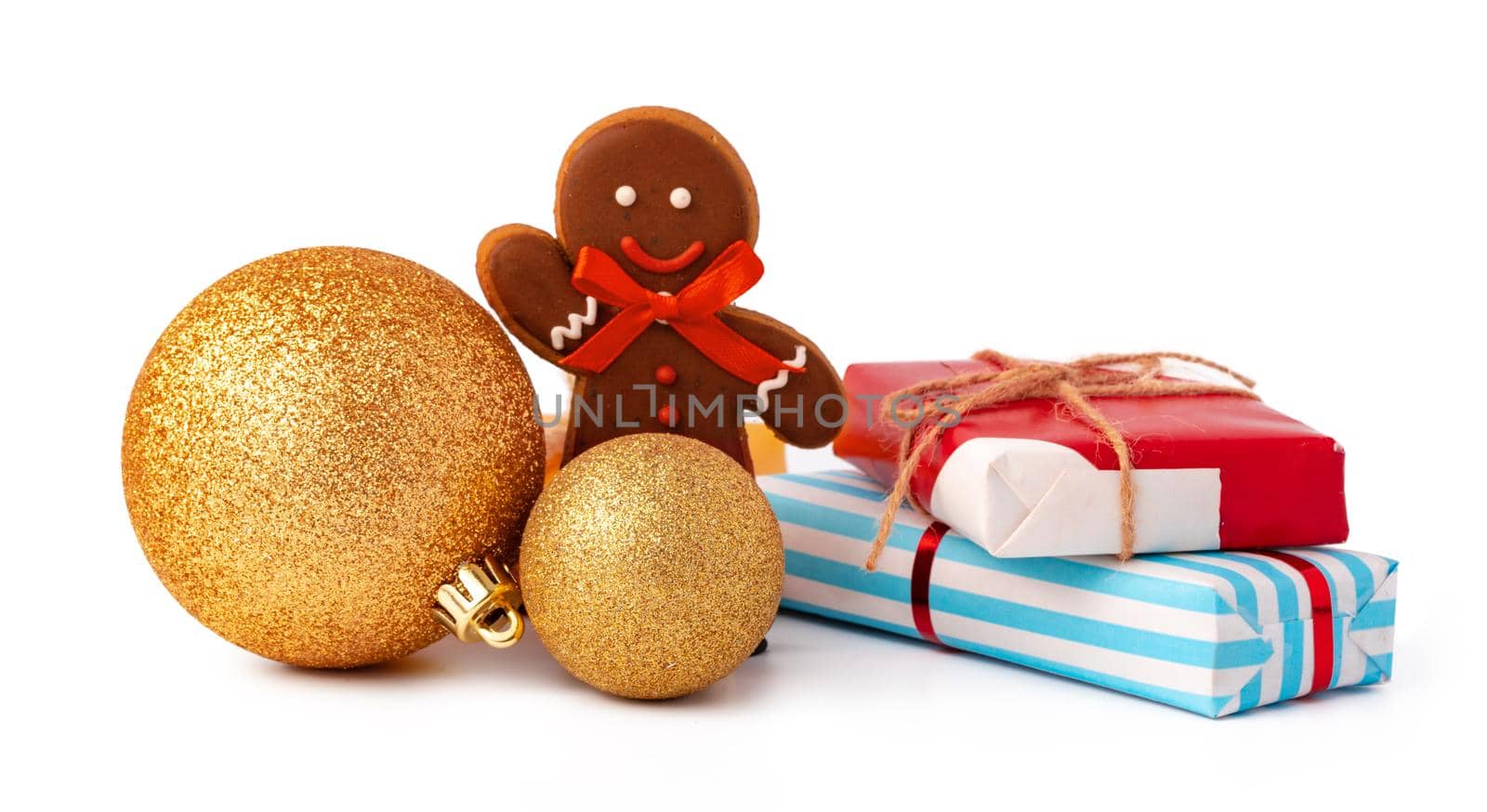 Christmas baubles and festive gift box isolated on white background, close up