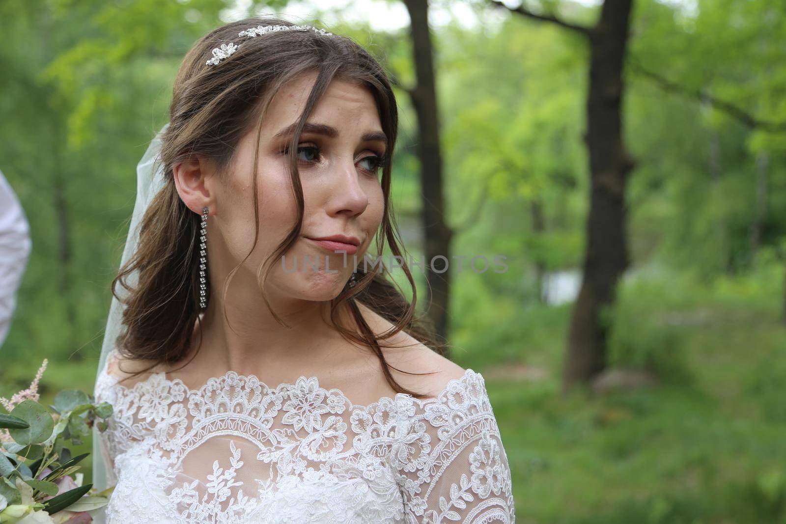 Wedding photography in rustic style emotions of the bride on the nature on the rocks