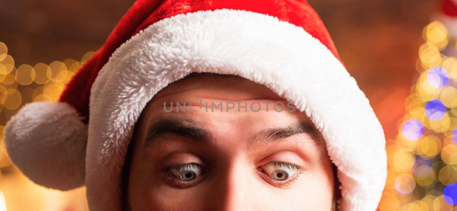 Merry Christmas. Greeting card with copy cpase. Santa eyes portrait close up. Text board, sale and discounts