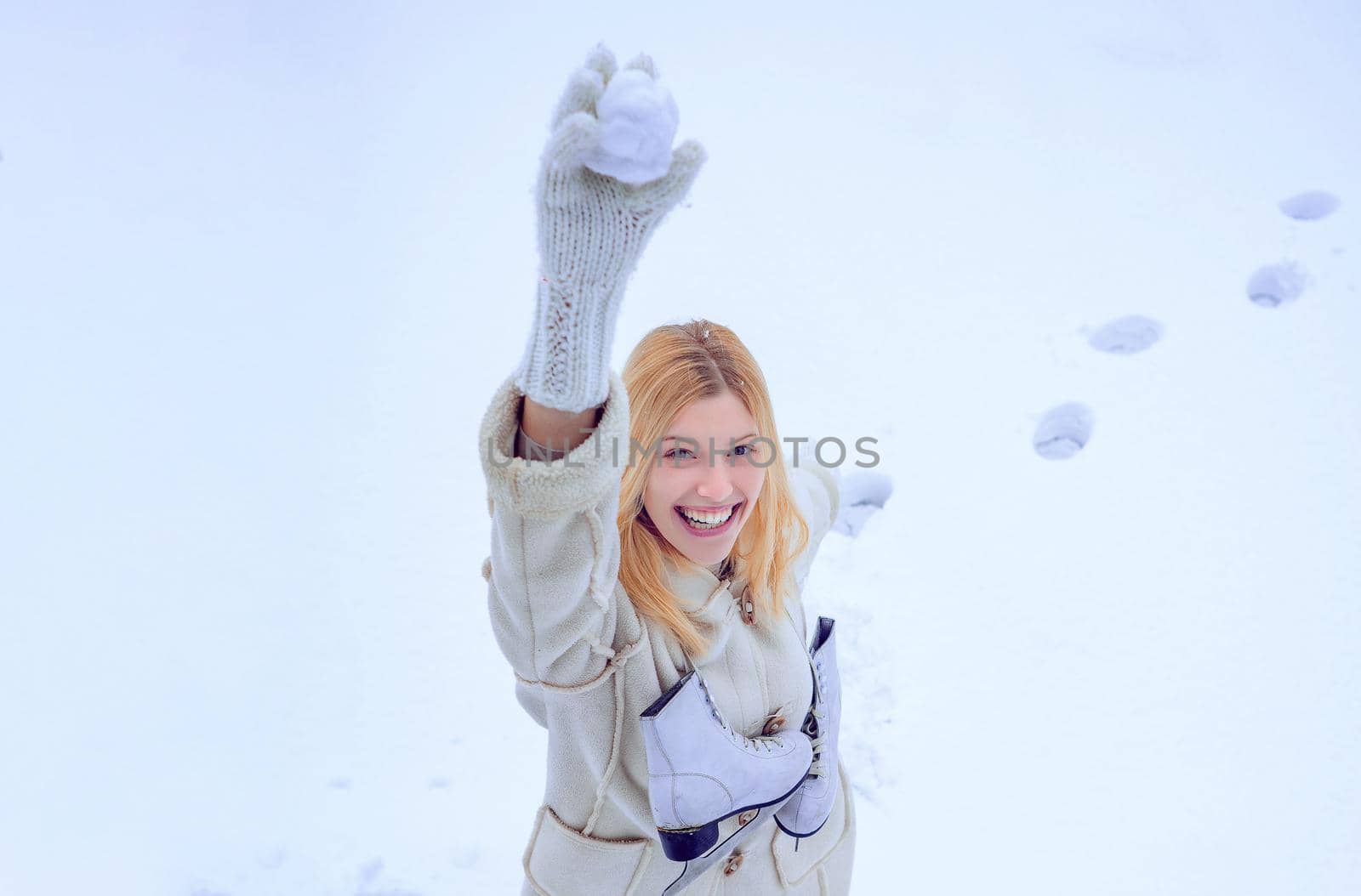 Love winter. Woman enjoying nature wintertime. Christmas. Happy young woman walking in winter time. by Tverdokhlib