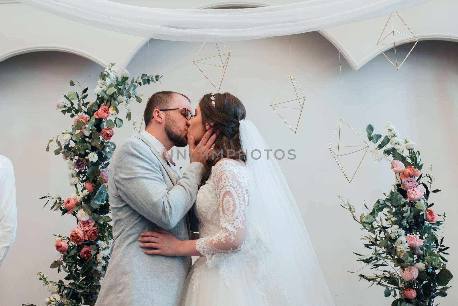 Wedding photography kiss bride and groom in different locations.