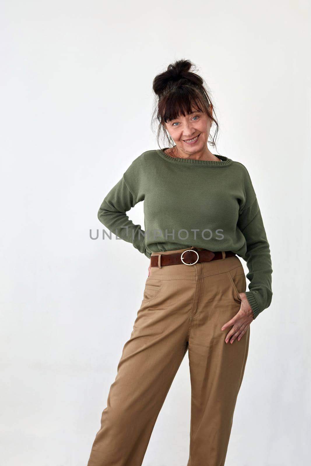 Delighted middle aged woman in trendy clothes by Demkat