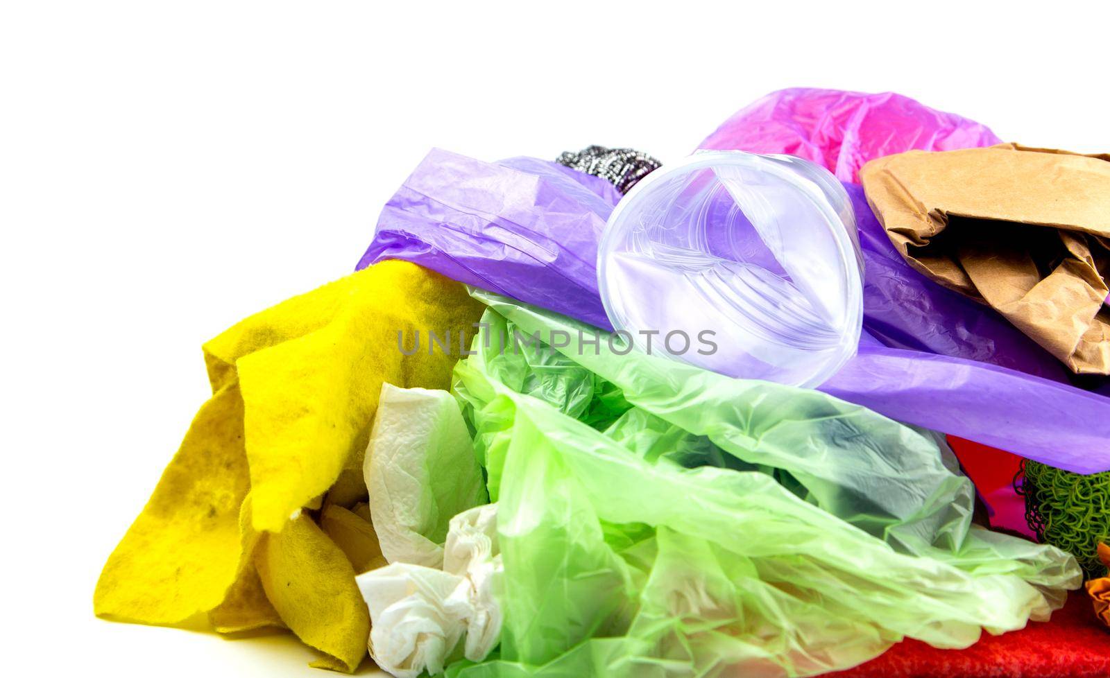 Concept of garbage and pollution. A pile of trash, crumpled plastic cup, packages, paper isolate on a white background.