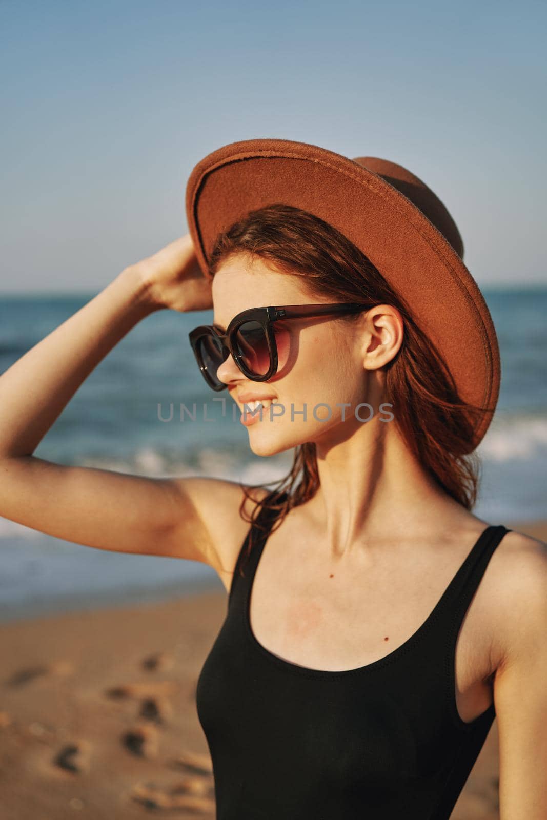 cheerful woman in sunglasses Sandy coast landscape sun by Vichizh