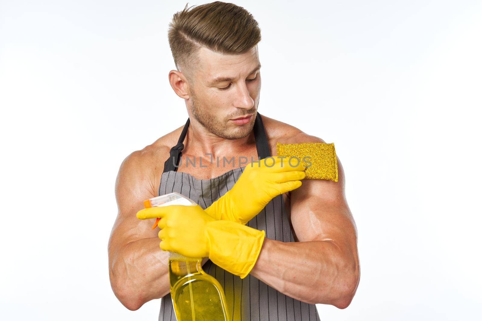 cleaner wearing an apron detergent cleaning housework. High quality photo