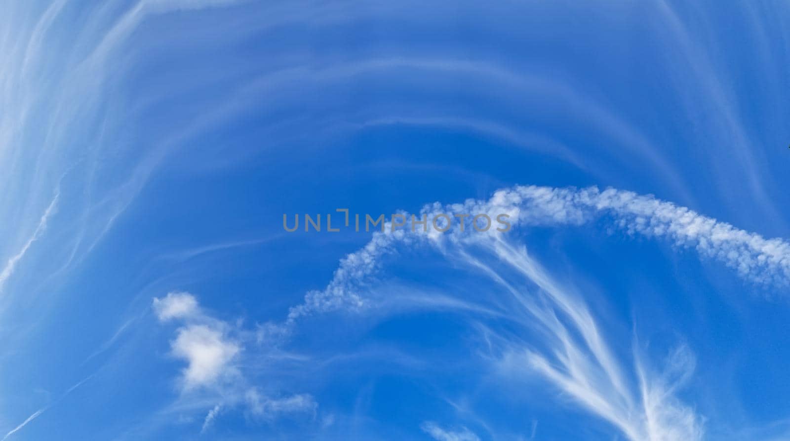 White clouds on the blue sky background. Panoramic photo by zakob337