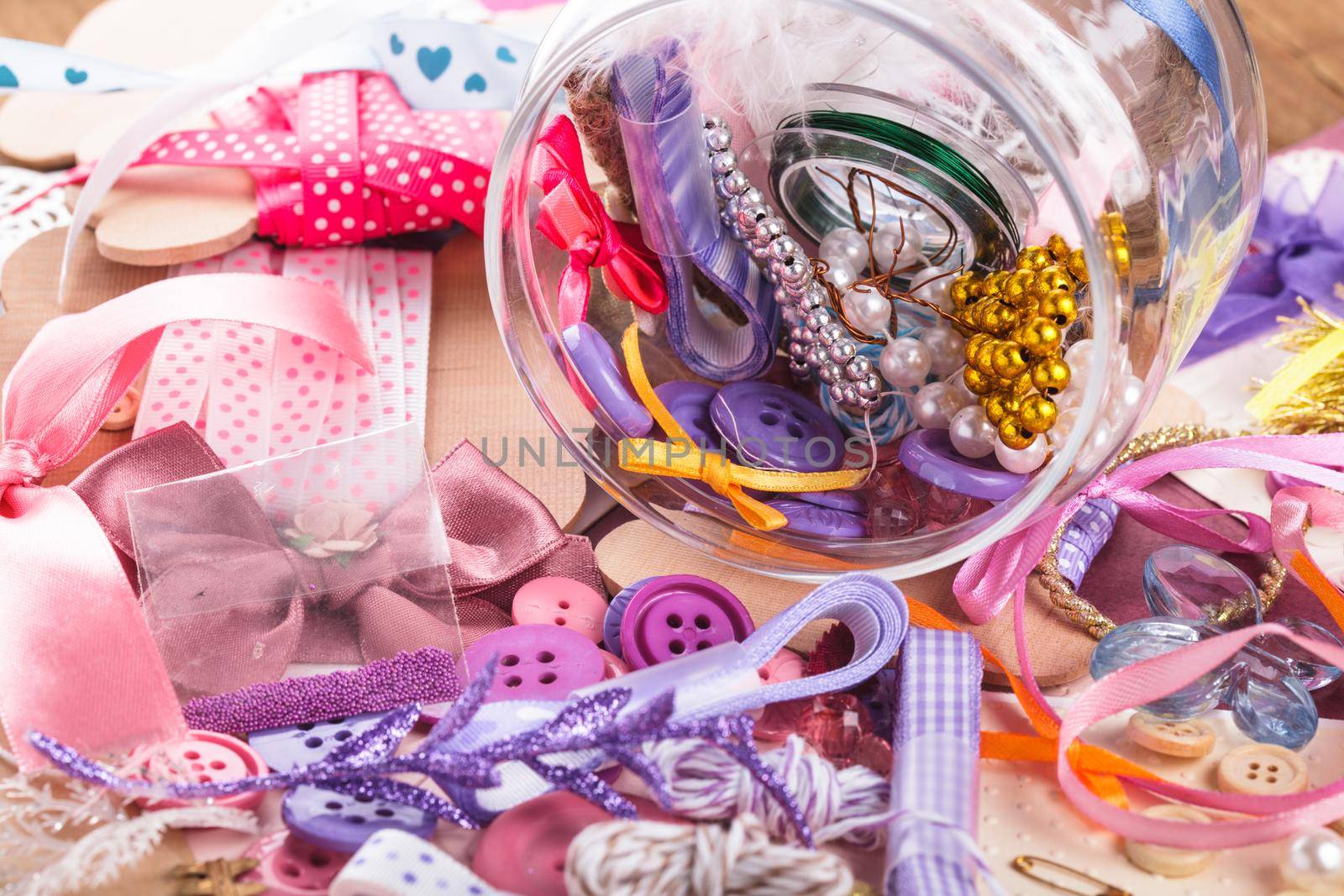 Scrapbooking craft materials in a glass bottle