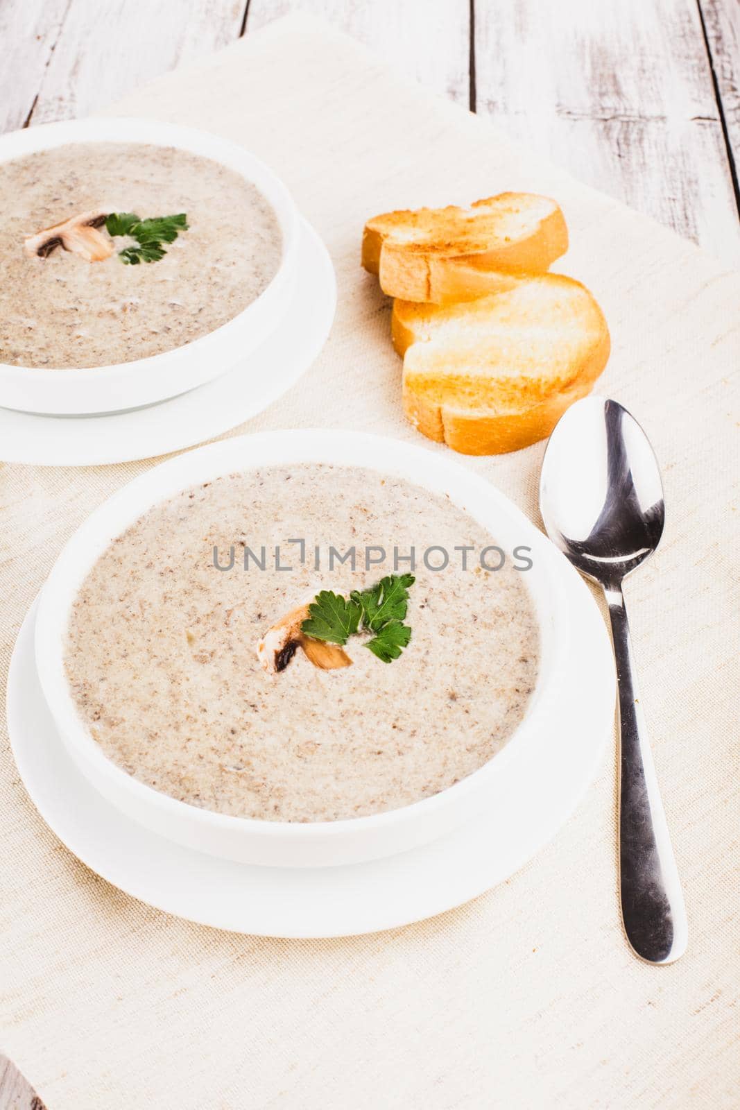 mushrooms cream soup with croutons - dried white loaf