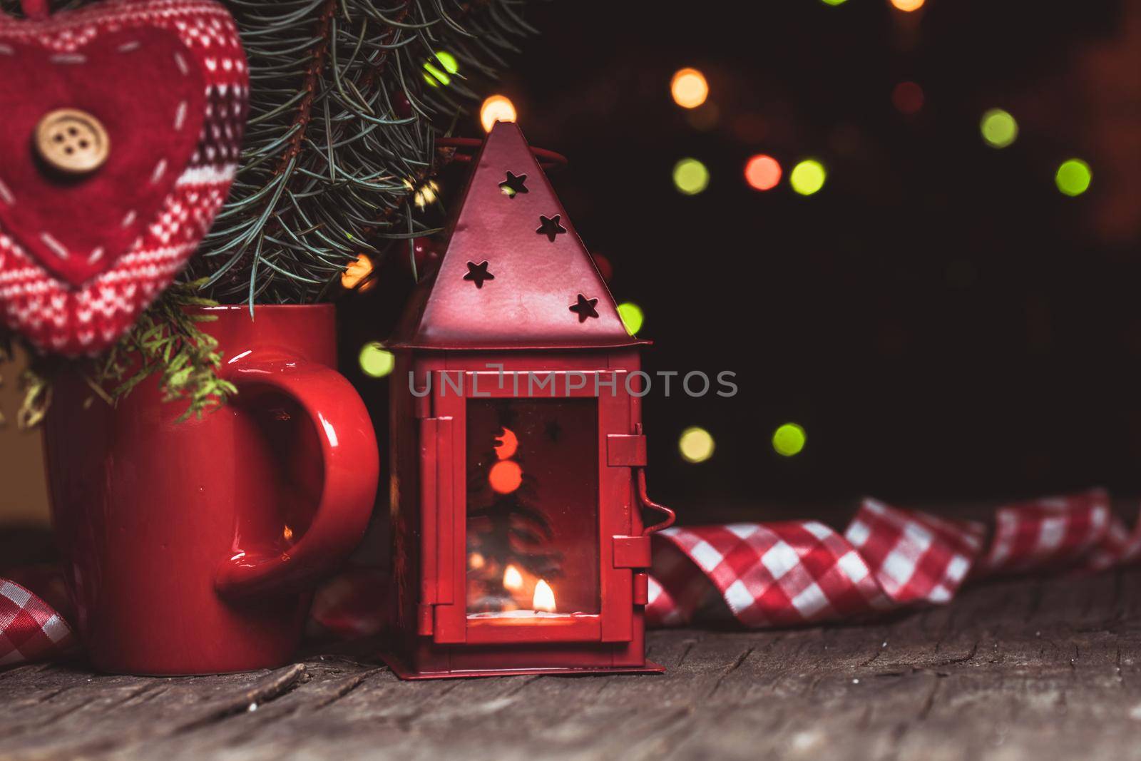 Handmade knitted heart - christmas decoration on the fir branch