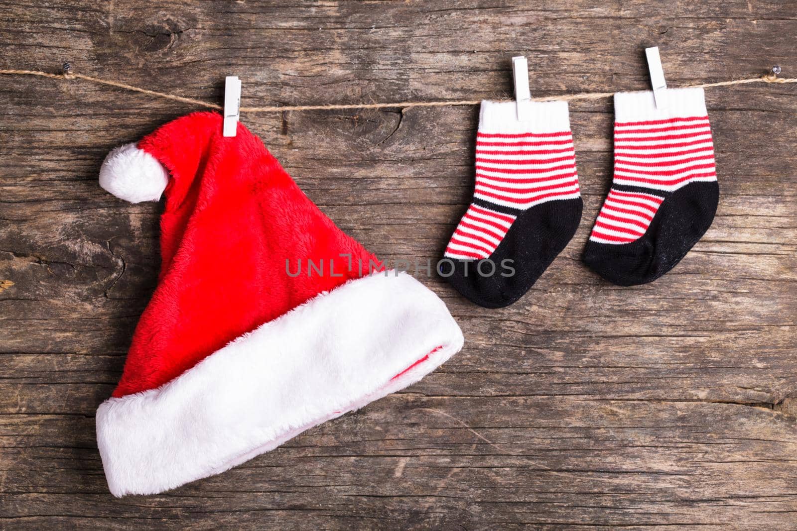 Santa hat attached to the rope with clothespin