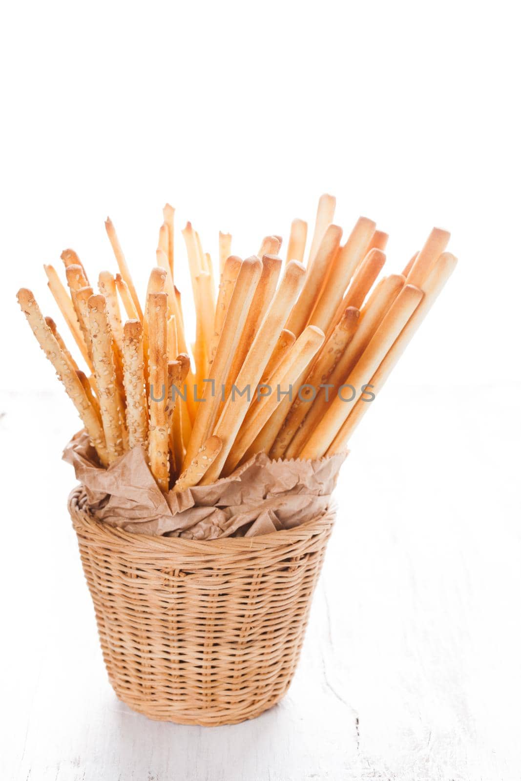 Different types of grissini breadsticks in a basket