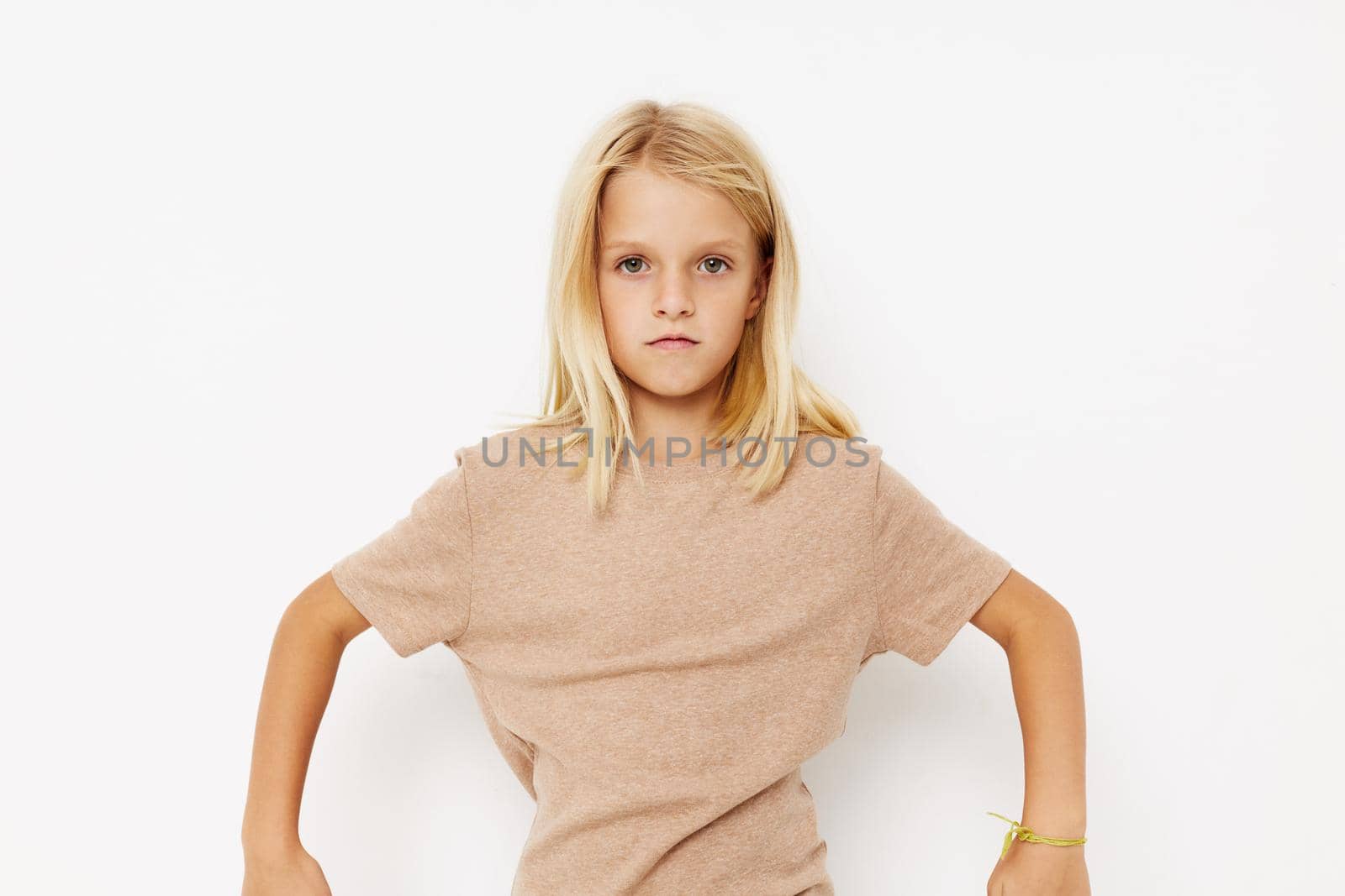 Beautiful little girl gestures with his hands isolated background. High quality photo